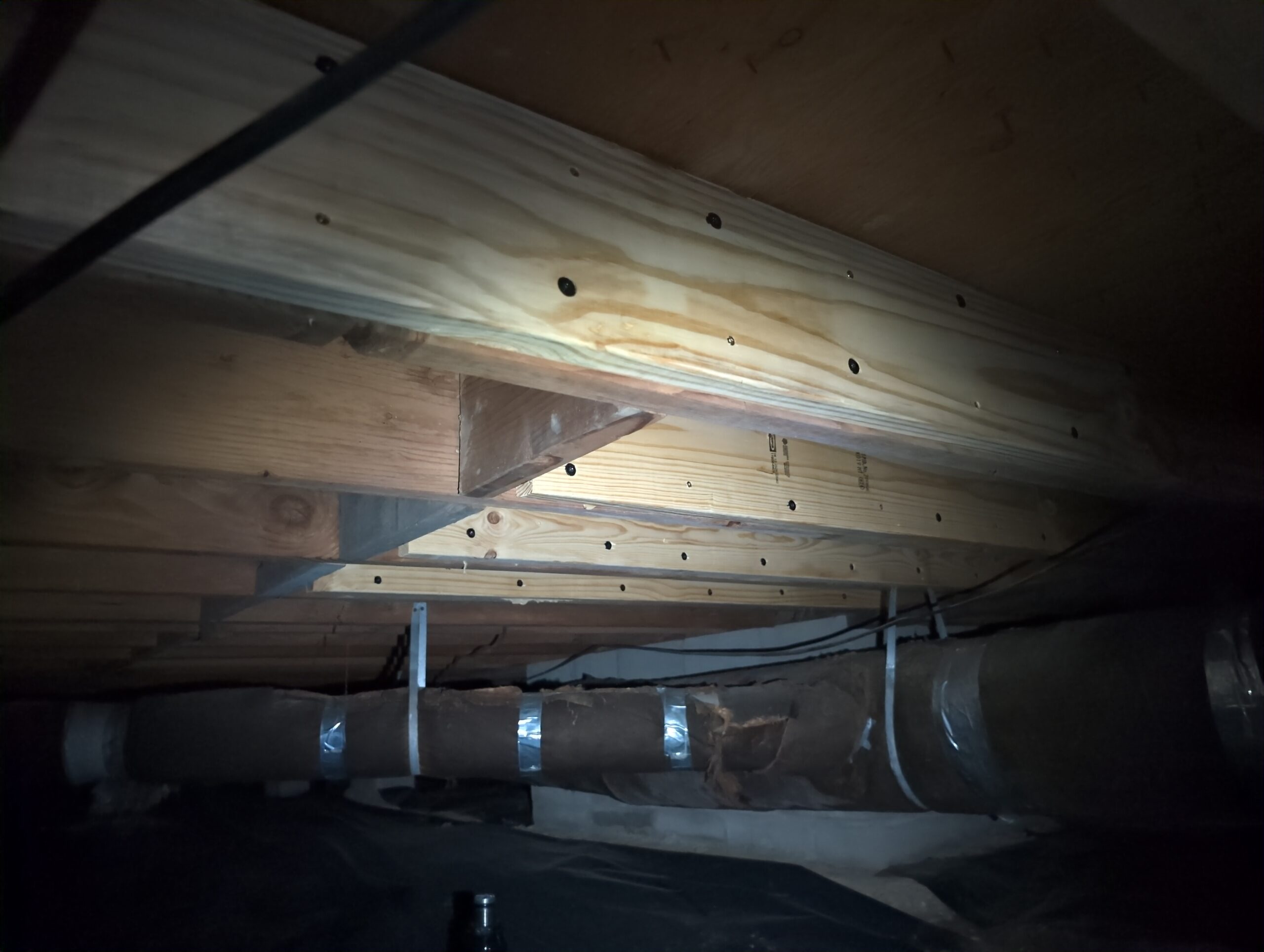 This image shows a structural joist repair job completed by PHI.